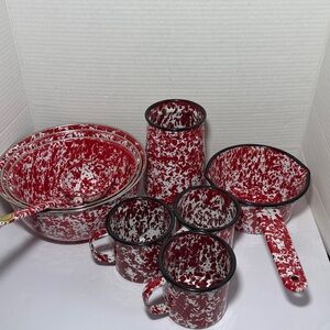Vintage enameled tableware set with red splashes: rustic kitchen decoration